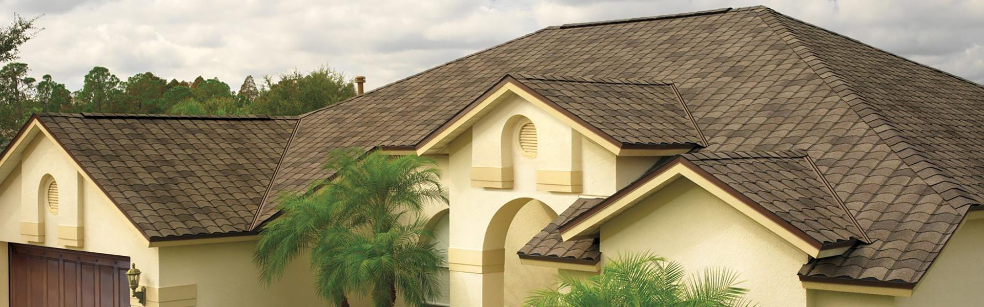 Home with a brown shingle roof